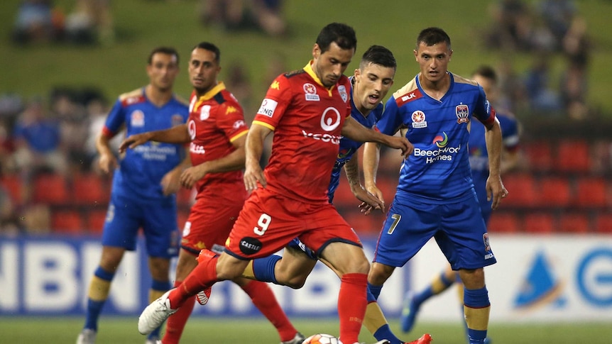 Adelaide United's Sergio Cirio controls the ball against the Jets