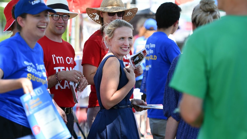 Kate Jones greets voters outside a polling booth in Brisbane