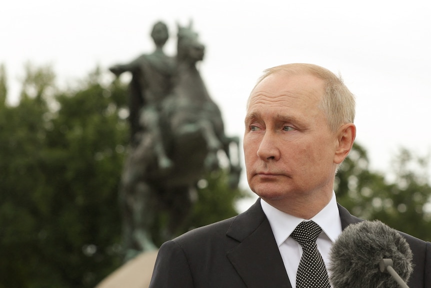 Vladimir Putin attends a parade