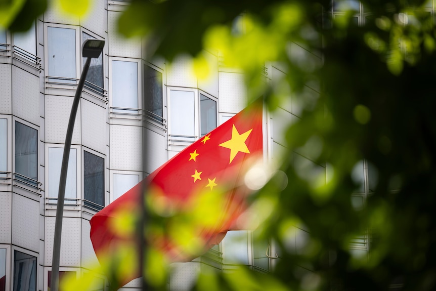 The Chinese flag flies in front of the embassy of China in Berlin, Germany. 
