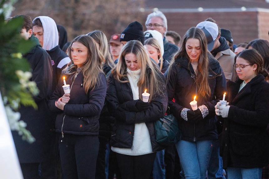 Students pay their respects at a vigil for the four University of Idaho students killed.