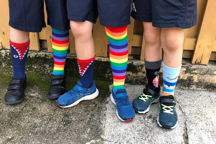 School students from behind wearing odd socks