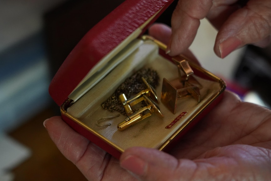 A box containing two sets of cufflinks