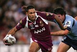 Justin Hodges breaks through the Blues defence