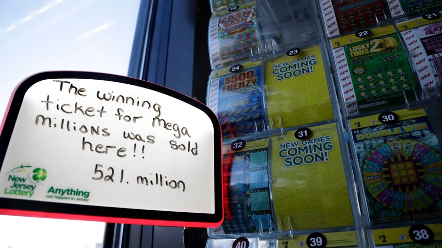 A sign is displayed near scratch-off tickets inside a Lukoil service station.
