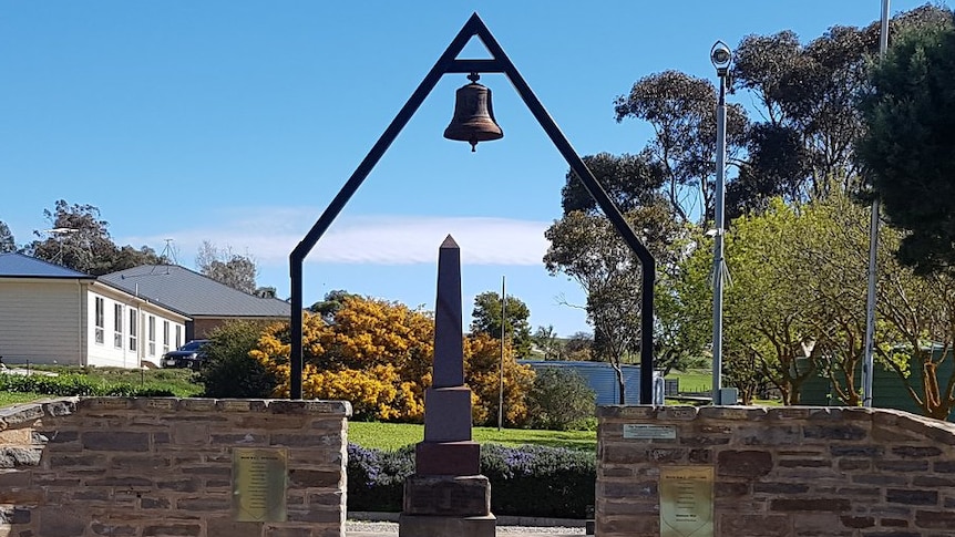 A bell at a memorial garden.