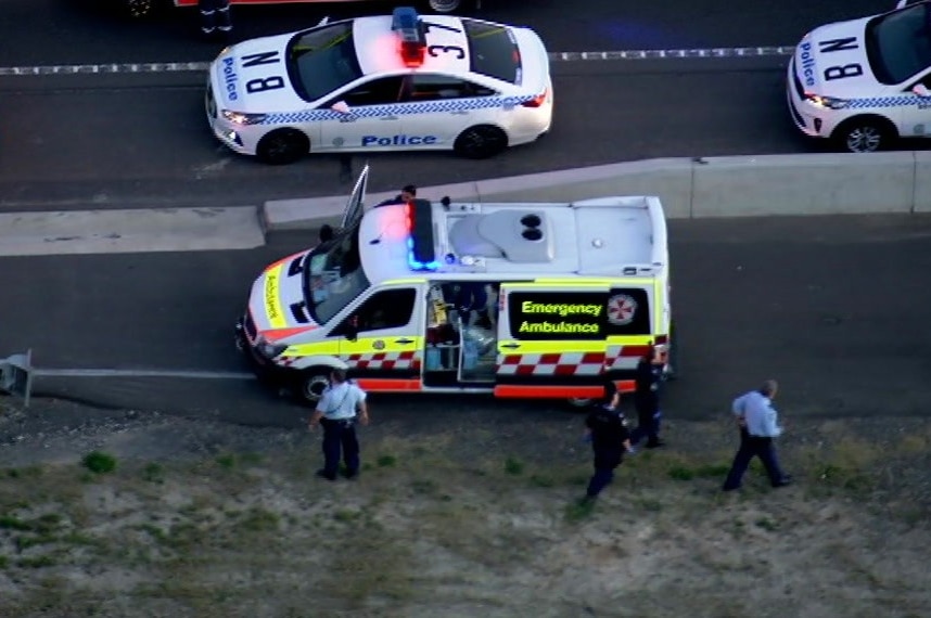 An ambulance on the side of a motorway.