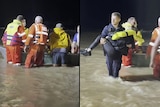 rescue workers carry a woman after she was rescued in a dhingy from floodwaters