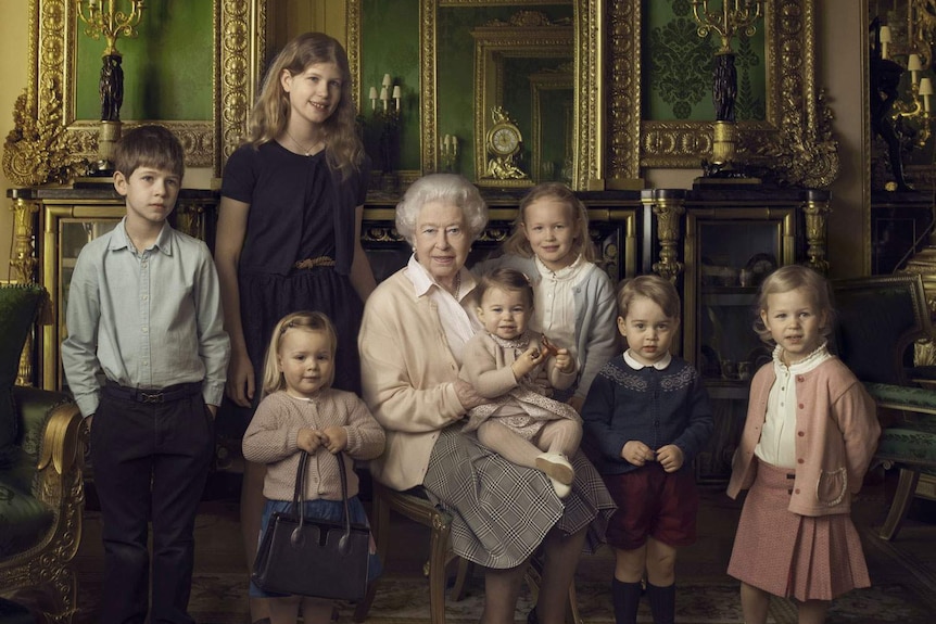 Queen Elizabeth II and various royal children pose for an official portrait in Windsor Castle