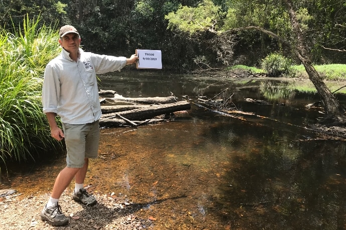 Brad Wedlock holding up a folder at one of the test sites