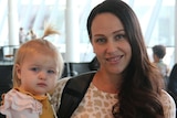 A mum and baby at the airport