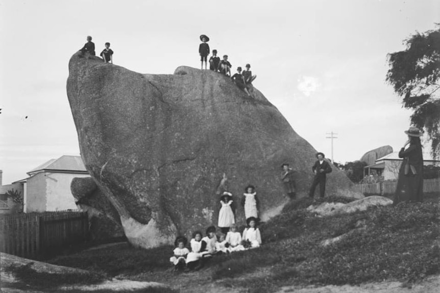 kids on top of a rock