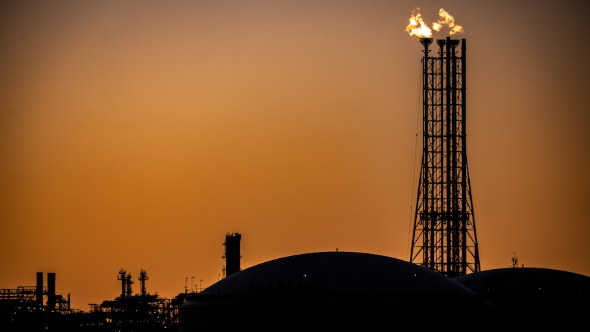 Fire at a gas plant at dusk.