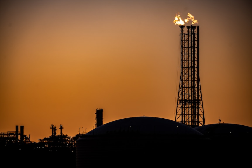 Fire at a gas plant at dusk.