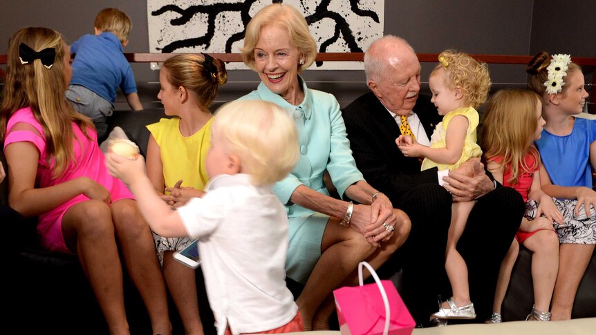 Dame Quentin Bryce and her husband Michael Bryce are surrounded by their grandchildren in Brisbane.