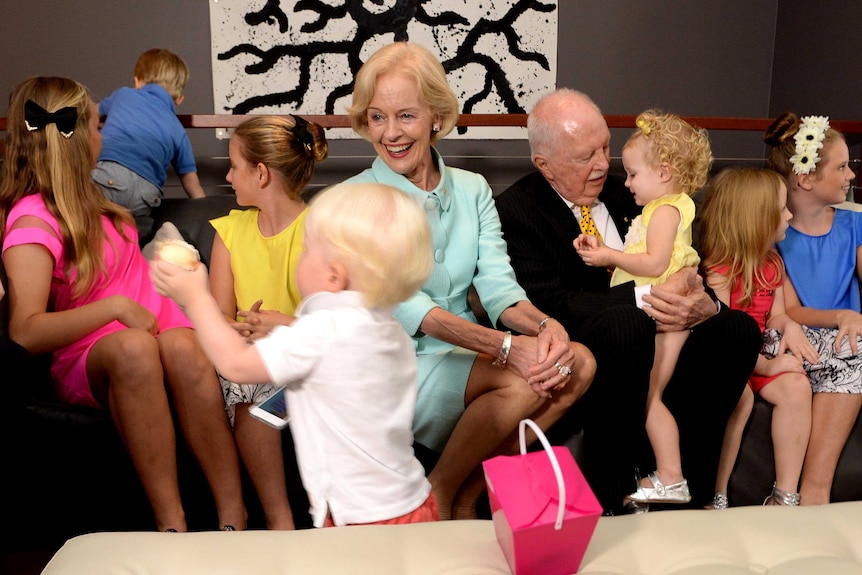 Dame Quentin and Michael Bryce surrounded by their grandchildren in Brisbane.