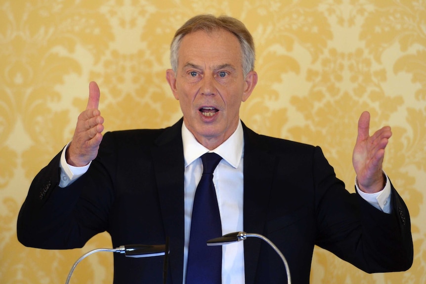 Former British prime minister Tony Blair gestures while delivering a speech.