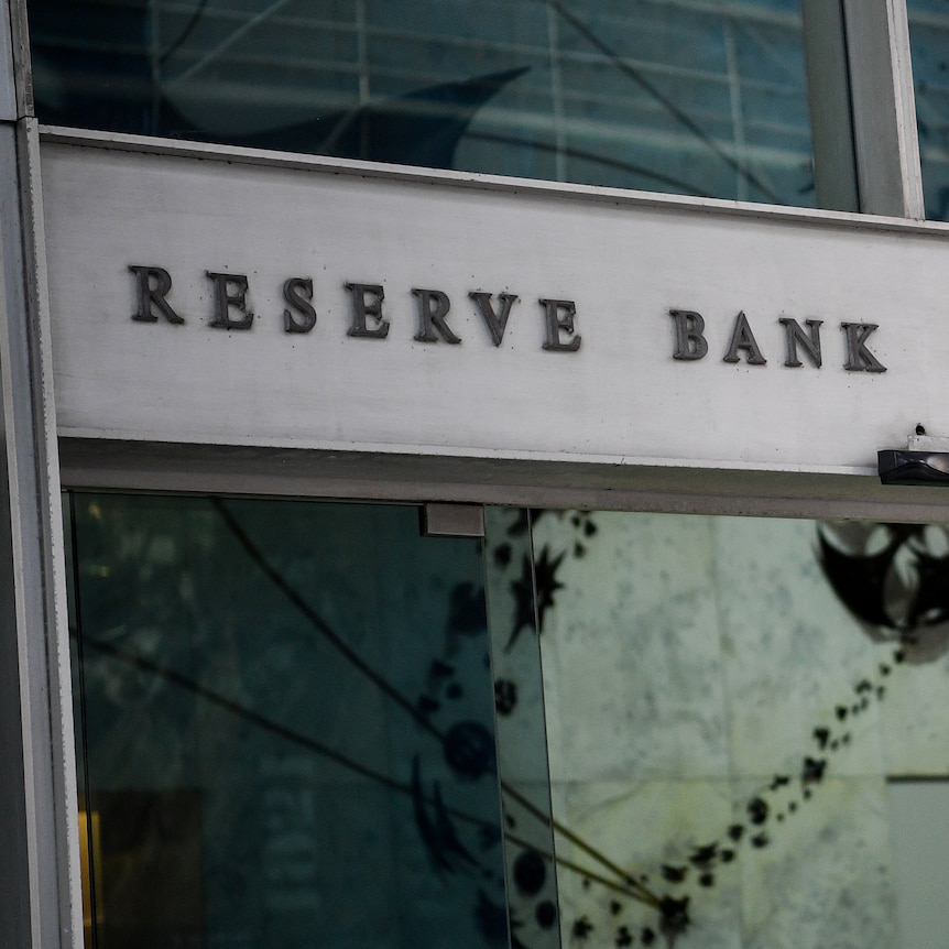 Sliding glass doors into a building with the words Reserve Bank of Australia written above.