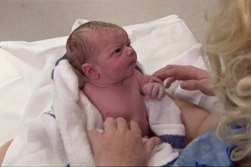 A newborn baby.