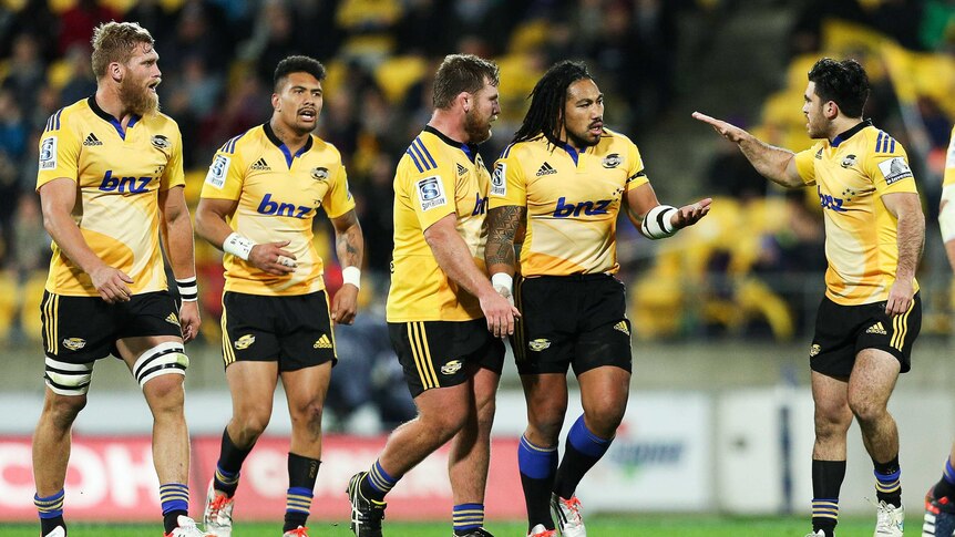 Ma'a Nonu of the Hurricanes is congratulated on his try by teammates