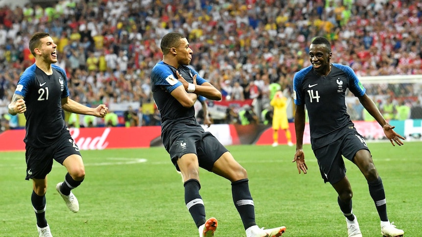 Kylian Mbappe crosses arms to celebrate scoring in World Cup final