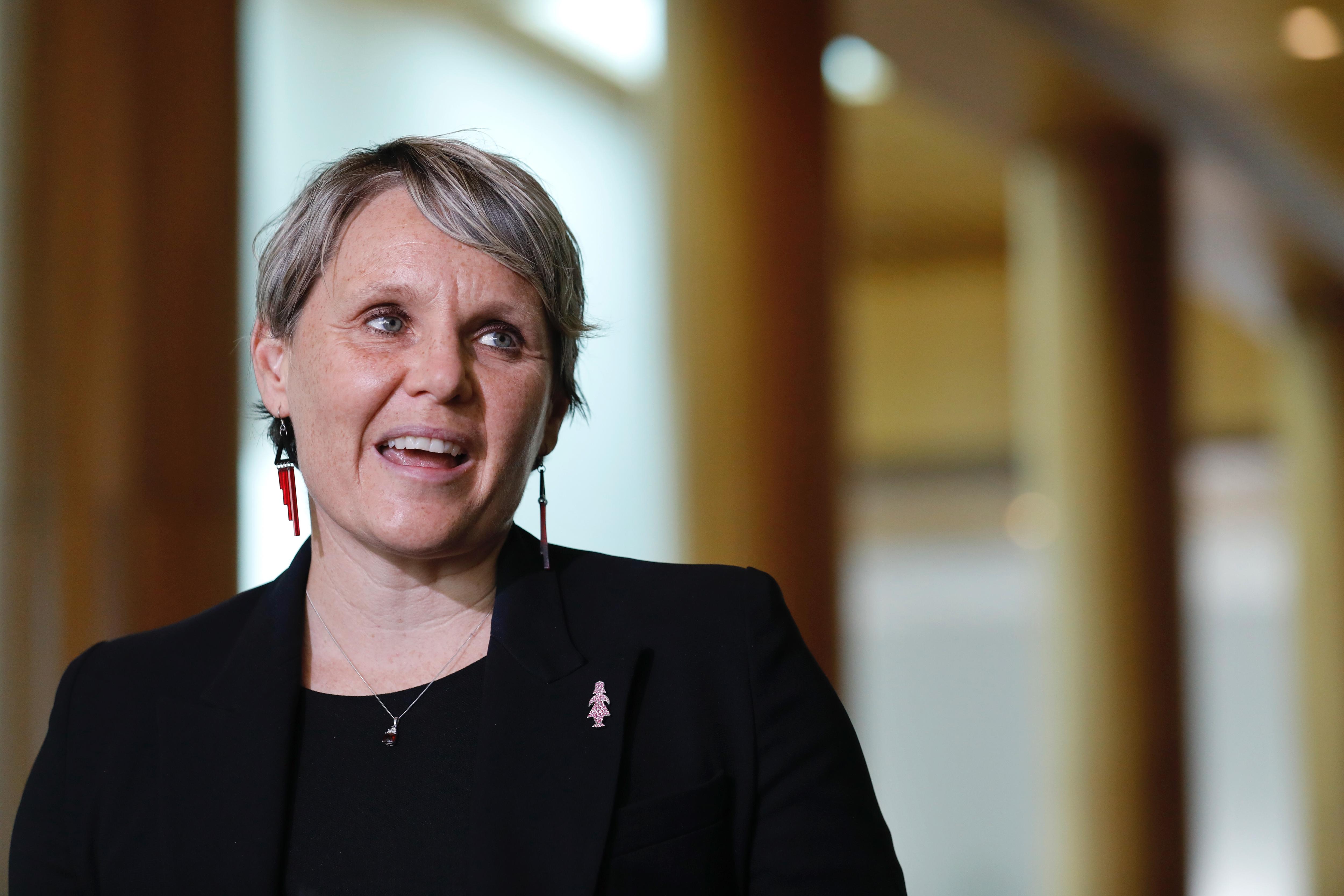 Peta Murphy smiling at a press conference. 