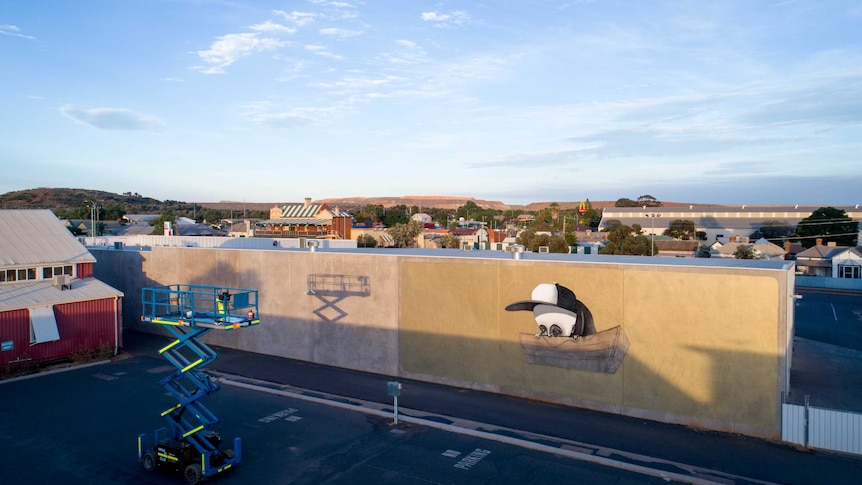 Elevated shot of a mural by artist Stormie Mills on the wall of a building in Kalgoorlie-Boulder.