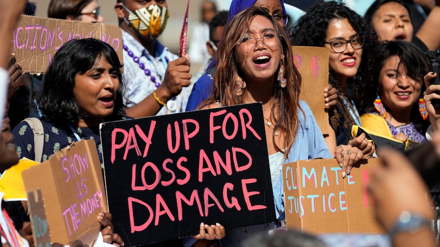 Mitzi Jonelle Tan, of the Philippines, center, participates in a Fridays for Future protest.
