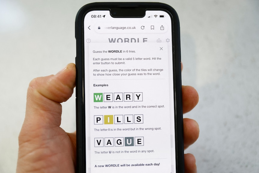 Instructions for Wordle, the web-based word game played on a mobile phone, are seen in this picture illustration.