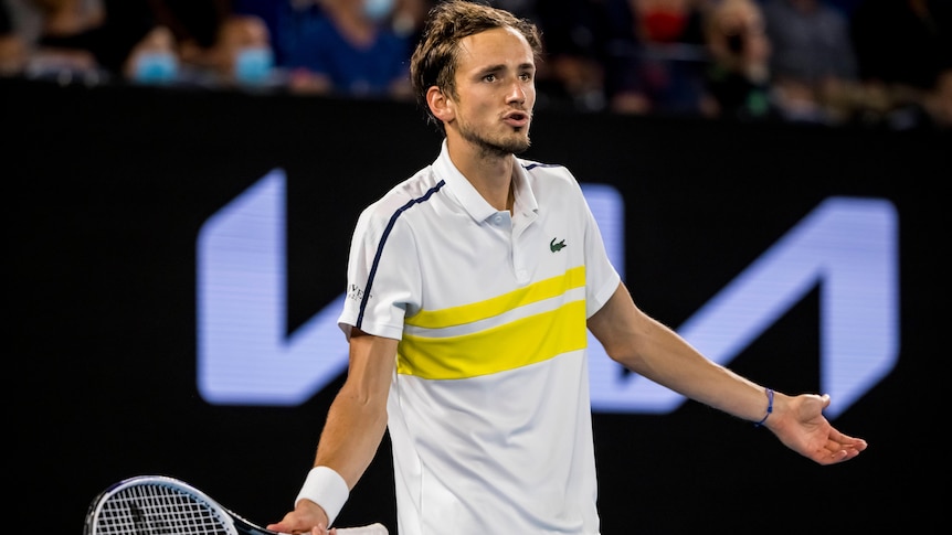 Daniil Medvedev holds his arms out on the court