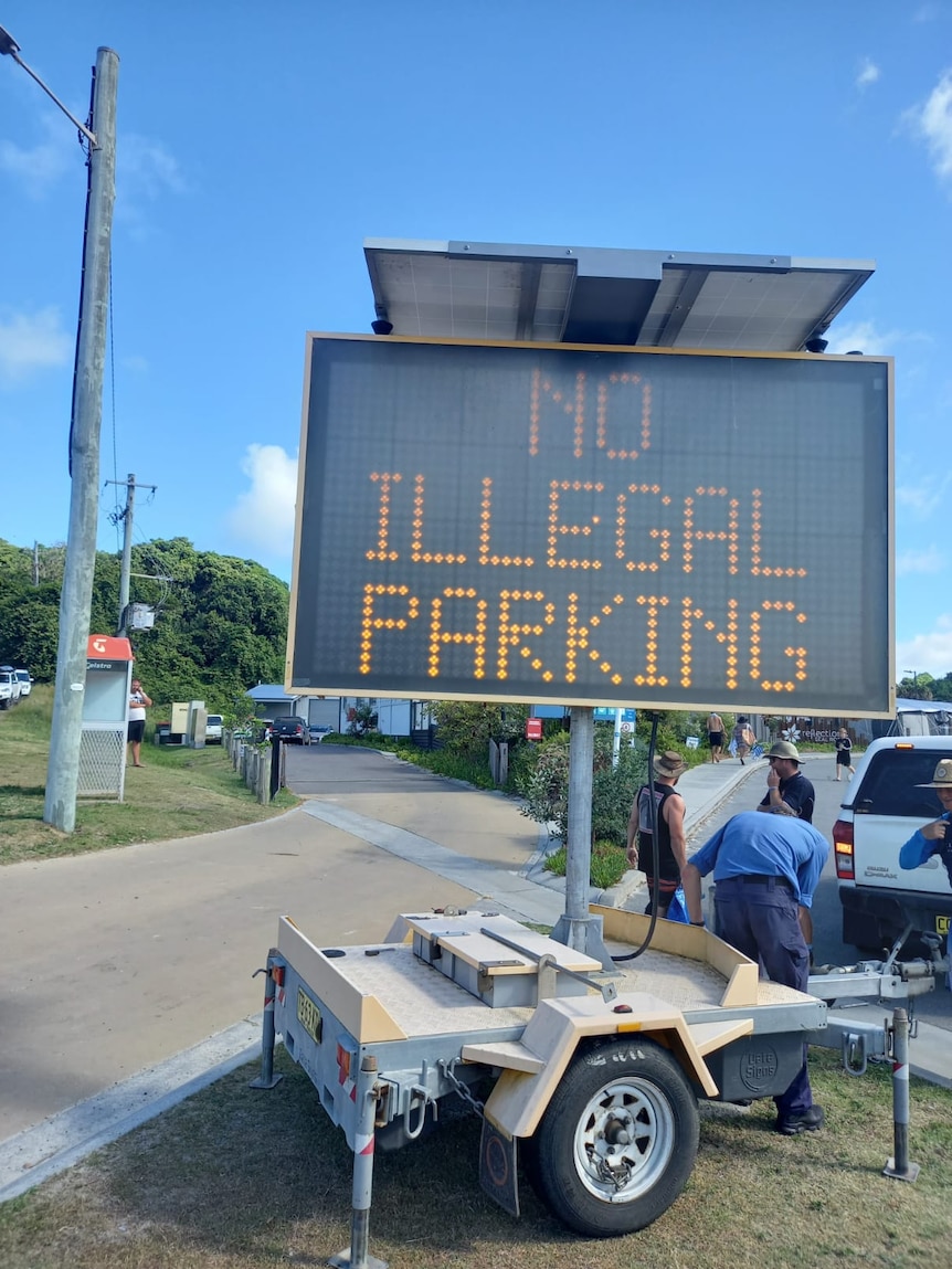 Electronic sign says "no illegal parking"