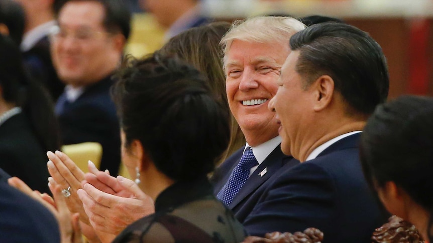 US President Donald Trump and China's President Xi Jinping attend at a state dinner.