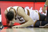 Andrew Bogut's Cleveland Cavaliers debut lasted less than a minute before he broke leg.