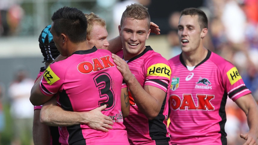 Penrith celebrate a try against Newcastle