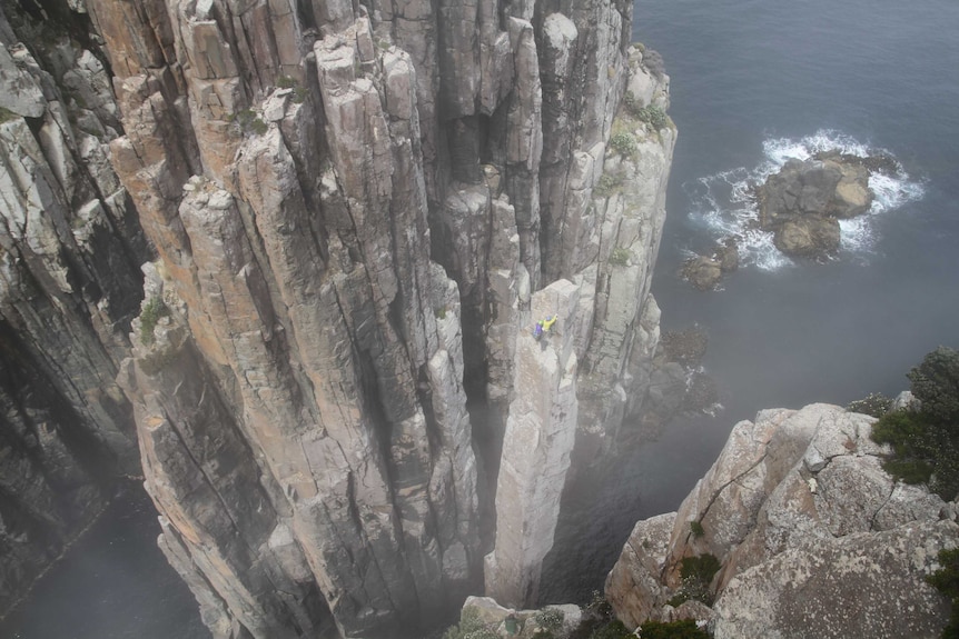 Climbers on the Totem Pole in Tasmania.