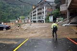 The front of a hotel is blocked by mudslide, caused by Super Typhoon Dujuan