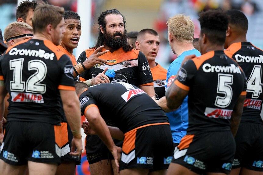 Aaron Woods and the Tigers look on during another loss