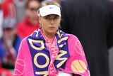 Sharapova fends off the cold at Wimbledon