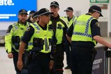 Tasmania Police officers at Hobart airport.