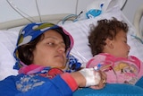 Woman and child injured in suspected Syrian chemical weapons attack