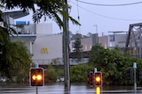 Traffic lights stick out from flooded Ellenborough Street in the Ipswich CBD.