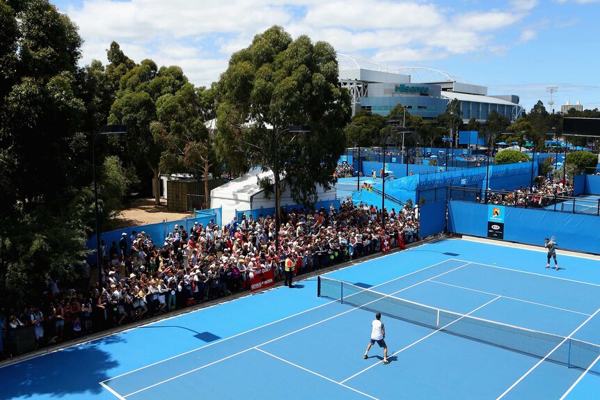 Obvious drawcard ... crowds gather to watch Roger Federer's practice session.