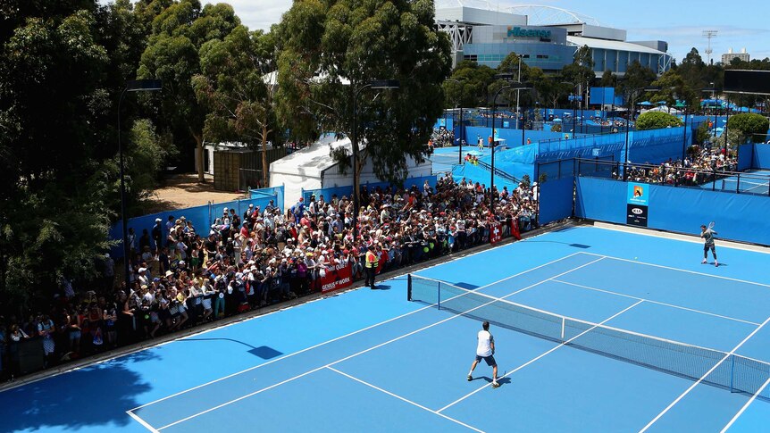 Obvious drawcard ... crowds gather to watch Roger Federer's practice session.