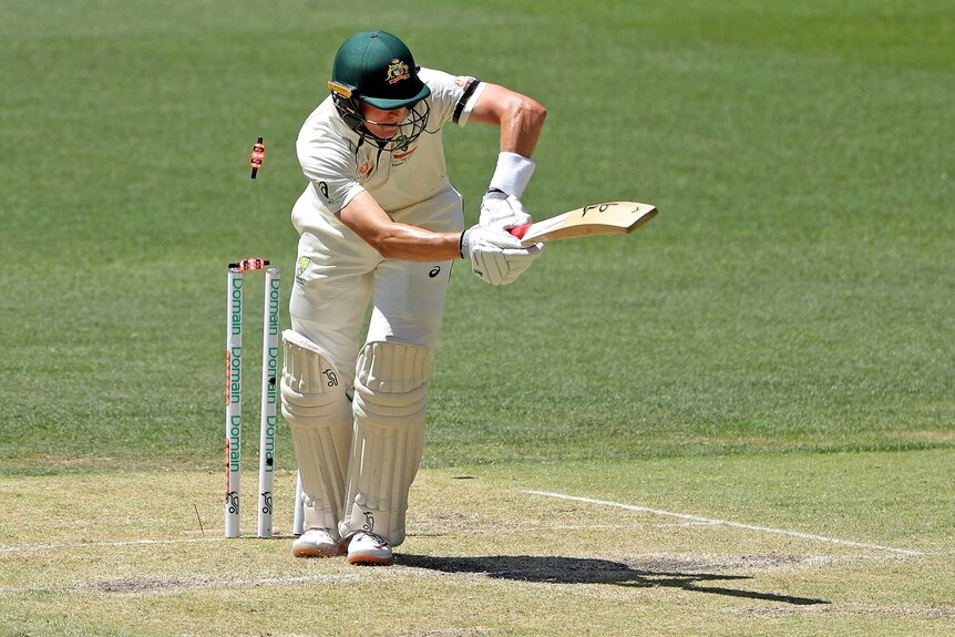Marnus Labuschagne plays a shot as his bails light up and fly off.