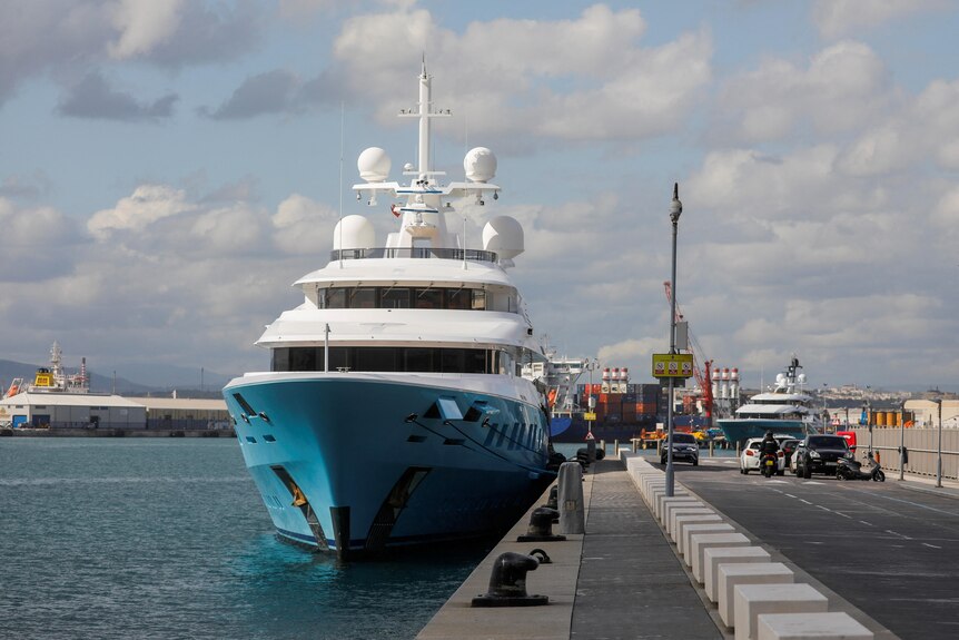 close picture of a superyacht docked at coastline in Gibraltar 
