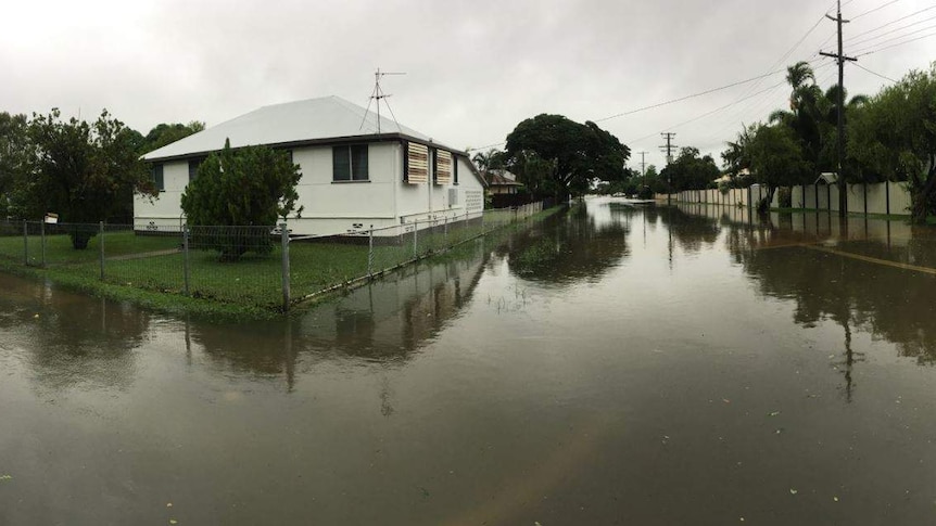 Flooded and deserted houses and streets in Townsville.