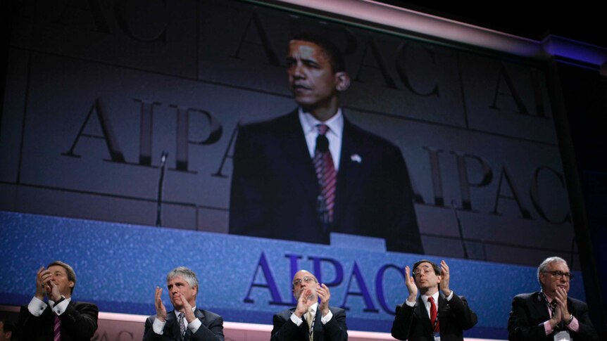 Delegates clap as US Democratic presidential candidate Senator Barack Obama speaks