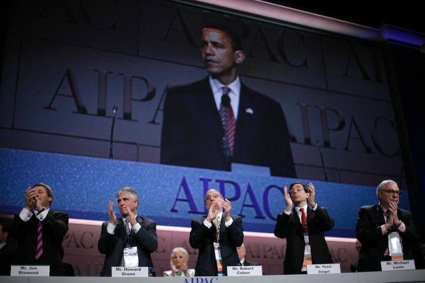 Delegates clap as US Democratic presidential candidate Senator Barack Obama speaks