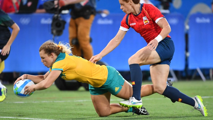Emma Tonegato scores a try in the rugby sevens match against Spain