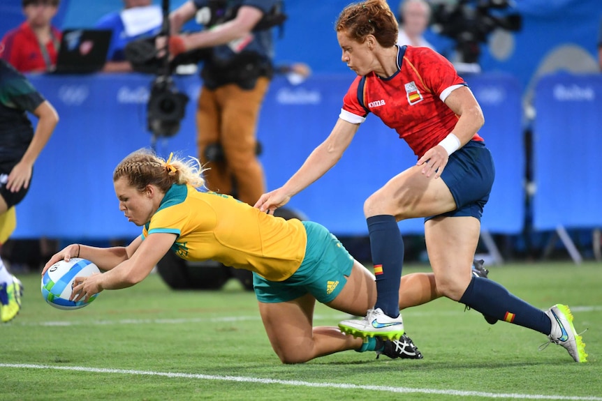 Emma Tonegato scores a try in the rugby sevens match against Spain